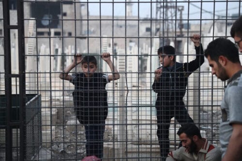 Meninos sírios em Damasco, em 14 de novembro de 2016 [Abd Doumany/ AFP via Getty Images]