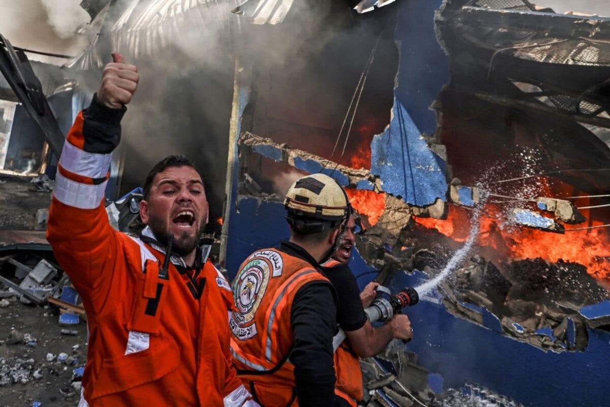    Palestinian firefighters douse a huge fire at the Foamco mattress factory following an Israeli airstrike, east of Jabalia in the northern Gaza Strip on May 17, 2021 [MAHMUD HAMS/AFP via Getty Images]
