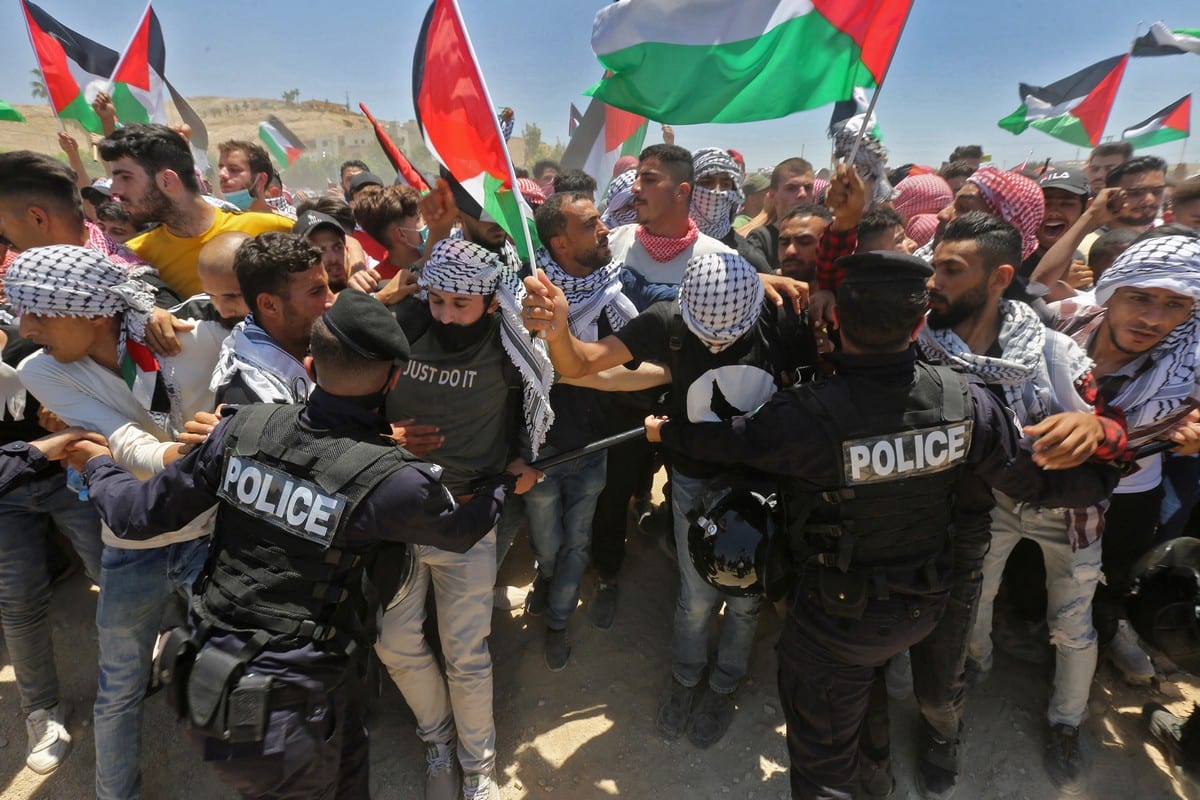 Manifestantes jordanianos protestam em solidariedade com os palestinos em 15 de maio de 2021 [AFP/Getty Images]