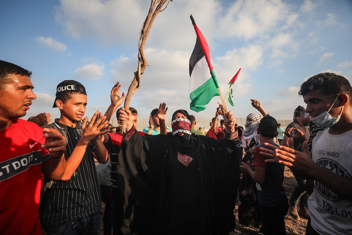 Palestinos protestam contra o cerco israelense na Cidade de Gaza, 21 de agosto de 2021 [Mustafa Hassona/Agência Anadolu]

