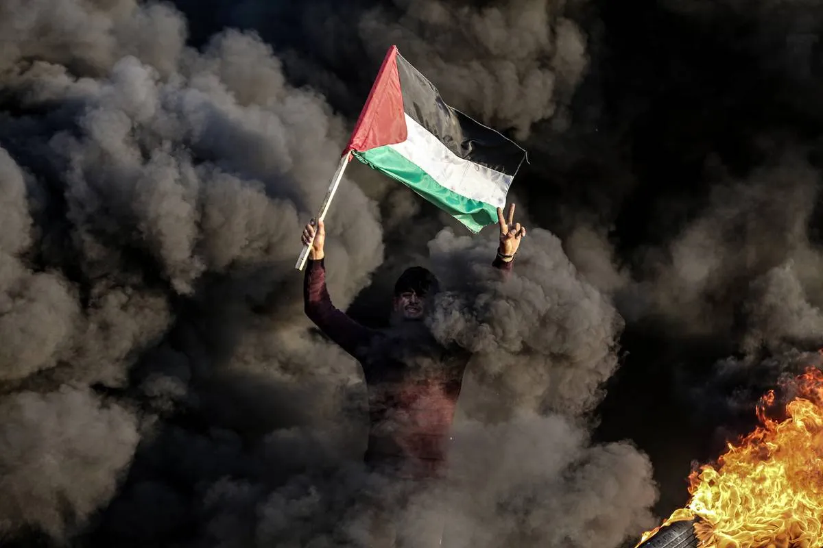 Palestinos protestam  depois que nove palestinos foram mortos pelo exército israelense na Cisjordânia na quinta-feira, 26 de janeiro de 2023 [Ali Jadallah/Agência Anadolu]

