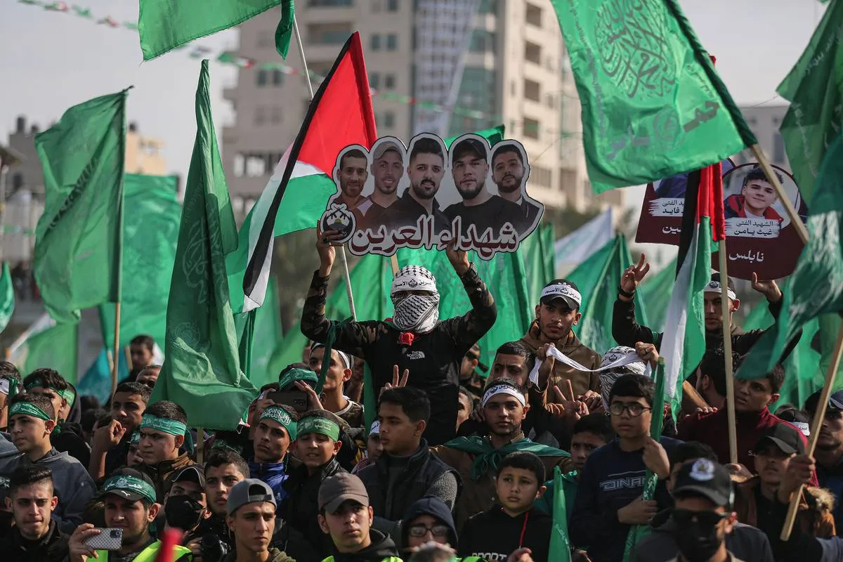 Palestinos celebram 35° aniversário do movimento Hamas na Cidade de Gaza, em 15 de dezembro de 2022 [Mustafa Hassona/Agência Anadolu]
